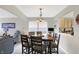 Bright dining area offers seating for six with an adjacent living room at 5772 Jamestown Square Ln, Indianapolis, IN 46234