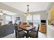 Open concept dining area adjacent to the living room with natural light at 5772 Jamestown Square Ln, Indianapolis, IN 46234