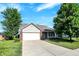 Attractive single-Gathering home with a two-car garage, set on a well-maintained lawn with mature trees at 5772 Jamestown Square Ln, Indianapolis, IN 46234
