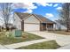 Charming single-Gathering home with a well-manicured lawn and attached two-car garage at 5772 Jamestown Square Ln, Indianapolis, IN 46234