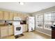 Well-lit kitchen with abundant cabinets and updated appliances, perfect for cooking at 5772 Jamestown Square Ln, Indianapolis, IN 46234