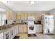 Bright kitchen boasts ample cabinet space, modern appliances, and a functional layout at 5772 Jamestown Square Ln, Indianapolis, IN 46234