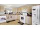 Bright kitchen with lots of cabinets, essential appliances, and practical layout at 5772 Jamestown Square Ln, Indianapolis, IN 46234