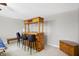 Charming living room featuring a wooden bar with seating, perfect for entertaining guests at 5772 Jamestown Square Ln, Indianapolis, IN 46234