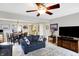 Inviting living room with plush seating, open to dining area, and featuring a ceiling fan at 5772 Jamestown Square Ln, Indianapolis, IN 46234