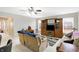 Spacious living room with large windows, a built-in entertainment center, and comfortable seating at 5772 Jamestown Square Ln, Indianapolis, IN 46234