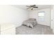 Bedroom with neutral carpet, a window providing natural light and outside views and a white dresser at 6199 N Caraway Dr, McCordsville, IN 46055