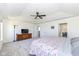 Comfortable bedroom with a tray ceiling, ceiling fan, and ample closet space at 6199 N Caraway Dr, McCordsville, IN 46055