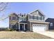Attractive two-story home with brick and siding, complemented by black shutters at 6199 N Caraway Dr, McCordsville, IN 46055