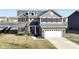 Beautiful two-story home with a two-car garage and well-manicured lawn at 6199 N Caraway Dr, McCordsville, IN 46055