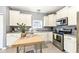 Bright kitchen with stainless steel appliances, white cabinets, and a stylish butcher block island at 6199 N Caraway Dr, McCordsville, IN 46055