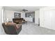 Cozy living room with plush carpet, ceiling fan and comfortable seating at 6199 N Caraway Dr, McCordsville, IN 46055