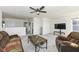 Spacious living room with a ceiling fan, plush carpet, and comfortable seating at 6199 N Caraway Dr, McCordsville, IN 46055
