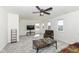Bright living room featuring plush carpet, a ceiling fan, and ample natural light at 6199 N Caraway Dr, McCordsville, IN 46055