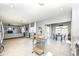 Open-concept living area with access to a dining space and a view of the backyard at 6199 N Caraway Dr, McCordsville, IN 46055