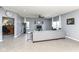 Neutral living area with tile floors, comfortable seating, and connections to home office and other rooms at 6199 N Caraway Dr, McCordsville, IN 46055