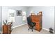 Cozy home office with a traditional wooden roll-top desk and abundant natural light from the windows at 6199 N Caraway Dr, McCordsville, IN 46055