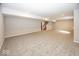 A large carpeted basement with stairs at 6323 Willow Branch Way, Plainfield, IN 46168