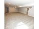 A spacious carpeted basement featuring neutral walls at 6323 Willow Branch Way, Plainfield, IN 46168