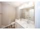 Bathroom featuring double sinks, a large mirror, and a shower at 6323 Willow Branch Way, Plainfield, IN 46168
