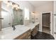 Bathroom with double vanity, large mirrors, and tile shower at 6323 Willow Branch Way, Plainfield, IN 46168