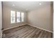 Bright bedroom with ample natural light and stylish floors at 6323 Willow Branch Way, Plainfield, IN 46168