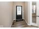 Entryway showcasing stylish flooring and neutral paint at 6323 Willow Branch Way, Plainfield, IN 46168