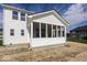 A white exterior elevation of a screened-in porch and home at 6323 Willow Branch Way, Plainfield, IN 46168
