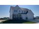 Beautiful two-story home with stone accents, a three-car garage, and a well-maintained front lawn at 6323 Willow Branch Way, Plainfield, IN 46168