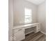 Home office features a built-in desk with drawers and a window for natural light at 6323 Willow Branch Way, Plainfield, IN 46168