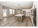 Bright, eat-in kitchen featuring a center island, stainless appliances, and ample lighting at 6323 Willow Branch Way, Plainfield, IN 46168