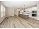 Modern kitchen featuring a large island, stainless steel appliances, and ample counter space at 6323 Willow Branch Way, Plainfield, IN 46168
