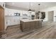 Open kitchen with stainless appliances, center island, and plenty of cabinet space at 6323 Willow Branch Way, Plainfield, IN 46168