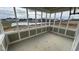 Enclosed sunroom with large windows overlooking a pond and neighborhood homes offering great views at 6323 Willow Branch Way, Plainfield, IN 46168