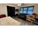 Cozy bedroom features new floors, great natural light, and room for a sitting area at 644 S Cole St, Indianapolis, IN 46241