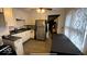 Modern kitchen with stainless steel appliances, sleek countertops, and ample cabinet space at 644 S Cole St, Indianapolis, IN 46241