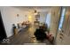Comfortable living room with hardwood floors, natural light, sofa, wooden table and chairs at 644 S Cole St, Indianapolis, IN 46241