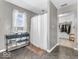 Bright bathroom with a shower curtain and adjacent walk-in closet at 6620 Avalon Blvd, Avon, IN 46123