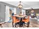 Dining room with updated chandelier, access to the Gathering room and sliding glass doors at 6620 Avalon Blvd, Avon, IN 46123