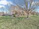Inviting two-story home with a covered front porch and landscaped front yard with mature shade tree at 6620 Avalon Blvd, Avon, IN 46123