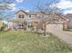Charming two-story home with a well-manicured lawn and welcoming front porch with brick pillars at 6620 Avalon Blvd, Avon, IN 46123