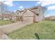A well-maintained home features a two-car garage and a lush lawn at 6620 Avalon Blvd, Avon, IN 46123