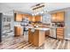 Cozy kitchen featuring an island with updated countertops, stylish cabinets, and modern appliances at 6620 Avalon Blvd, Avon, IN 46123