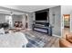 Stylish living area featuring an electric fireplace, flat screen television and an open layout at 6620 Avalon Blvd, Avon, IN 46123