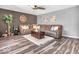 Inviting living room featuring a cozy sectional sofa, stylish decor, and modern ceiling fan at 6620 Avalon Blvd, Avon, IN 46123