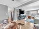Open-concept living area with hardwood floors, flat-screen TV and natural light at 6620 Avalon Blvd, Avon, IN 46123