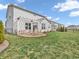 Large backyard features a patio, manicured lawn, and lush landscaping at 6915 Diamondleaf Way, Brownsburg, IN 46112