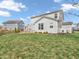 Spacious backyard with a well-maintained lawn and a charming patio area perfect for entertaining at 6915 Diamondleaf Way, Brownsburg, IN 46112
