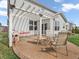 Outdoor patio area with elegant seating, a dining table set, and a well-maintained lawn at 6915 Diamondleaf Way, Brownsburg, IN 46112
