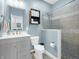 Updated bathroom with a gray vanity, new toilet, and walk-in shower with tiled accents at 6915 Diamondleaf Way, Brownsburg, IN 46112